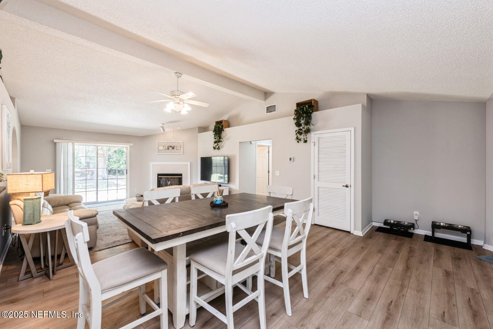 1962 Little River Drive Fleming Island, FL 32003 - Photo 7 of 29 a view of a dining room with furniture and wooden floor