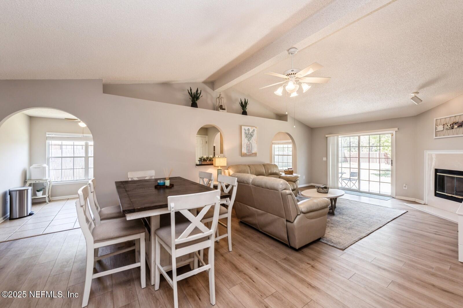 1962 Little River Drive Fleming Island, FL 32003 - Photo 10 of 29 a living room with furniture a fireplace and wooden floor