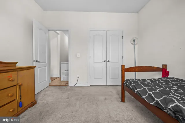 a bedroom with a bed and a cabinets