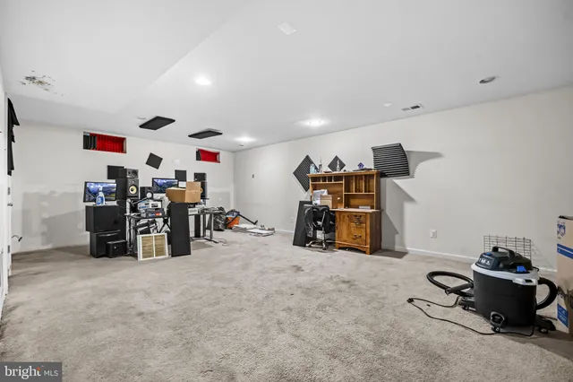 a view of a garage with a bike and white walls