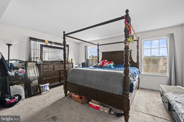 a bed room with furniture and a window