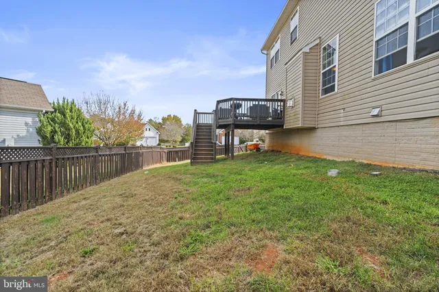a view of a backyard with sitting area
