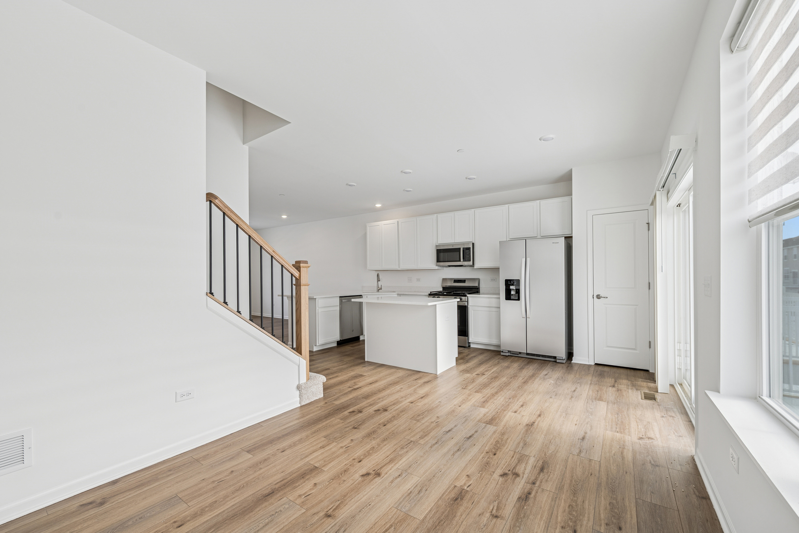 12312 Tinsley Street Huntley, IL 60142 - Photo 13 of 24 a view of a kitchen with wooden floor and electronic appliances