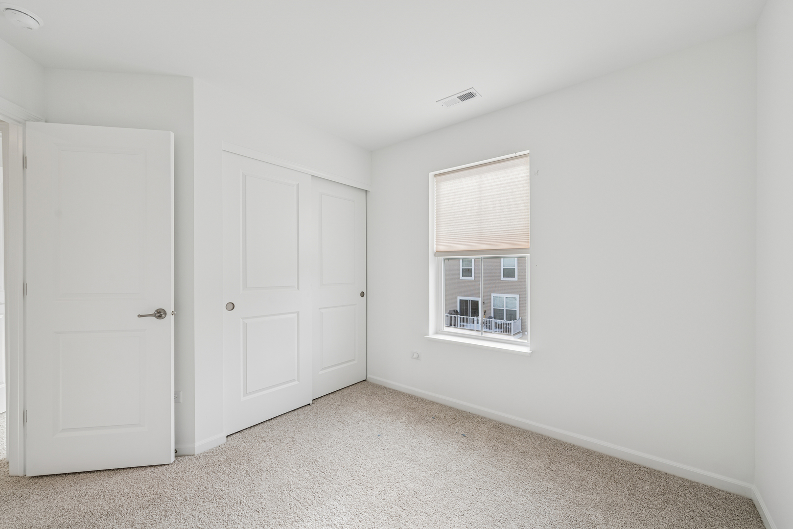 12312 Tinsley Street Huntley, IL 60142 - Photo 16 of 24 a view of an empty room with a window