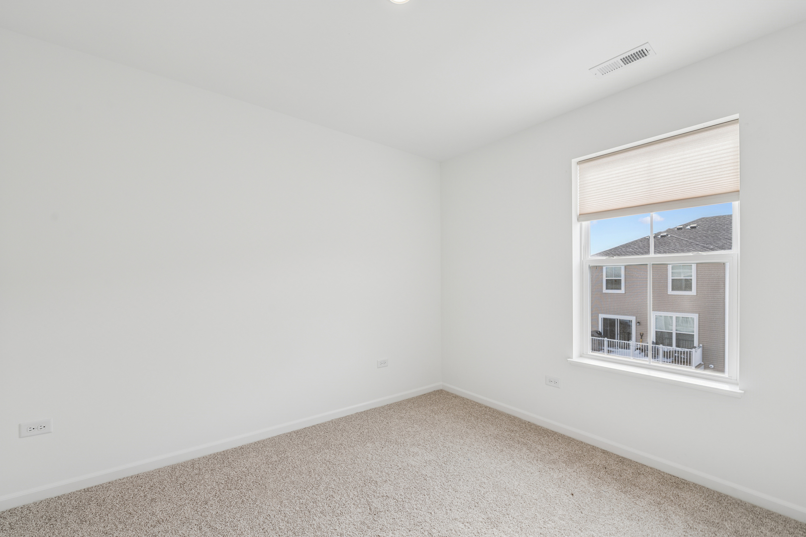 12312 Tinsley Street Huntley, IL 60142 - Photo 17 of 24 an empty room with a window