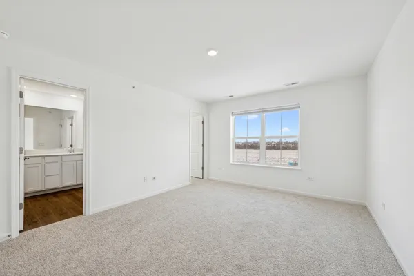an empty room with a bathroom