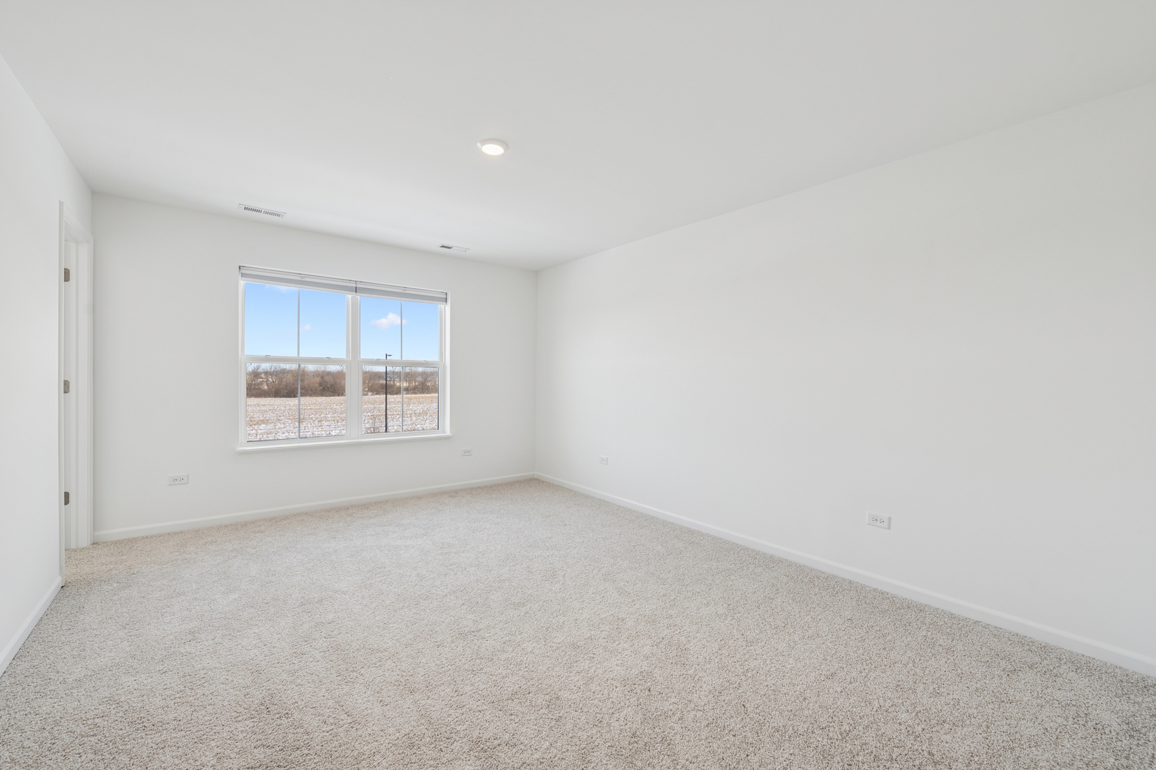 12312 Tinsley Street Huntley, IL 60142 - Photo 20 of 24 a view of an empty room with a window