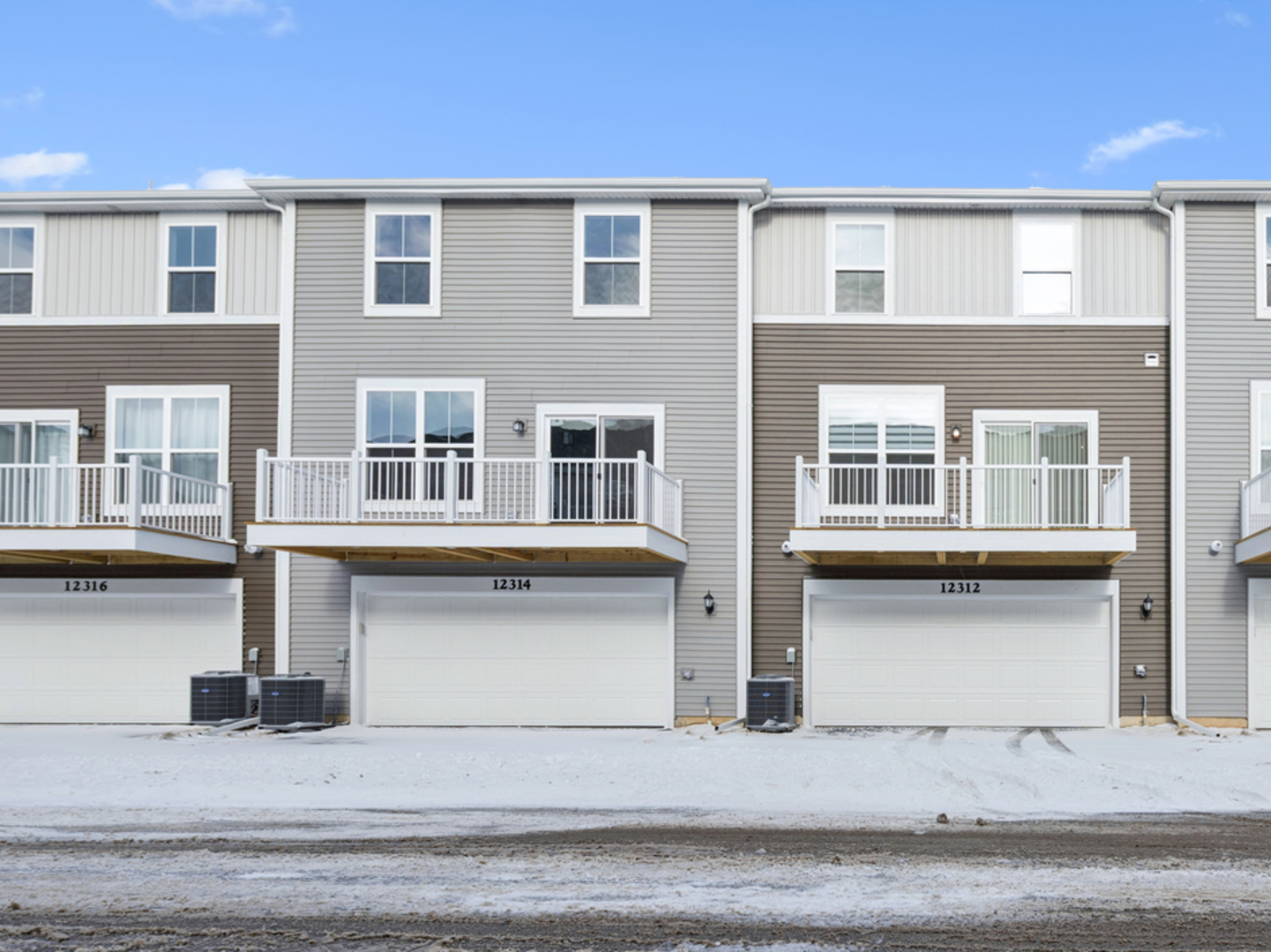12312 Tinsley Street Huntley, IL 60142 - Photo 2 of 24 a front view of residential houses with stairs