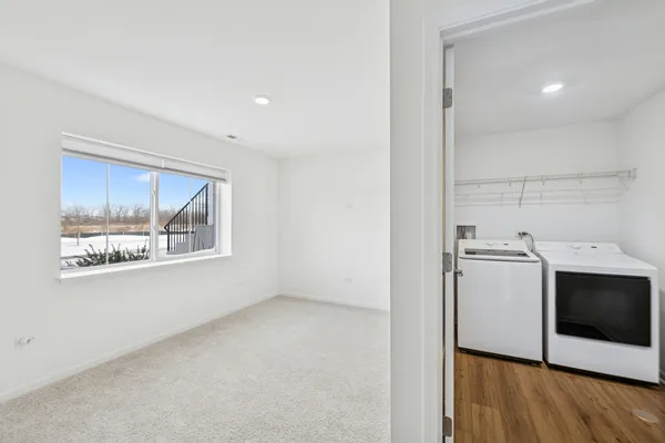 a view of a storage & utility room with wooden floor cabinet