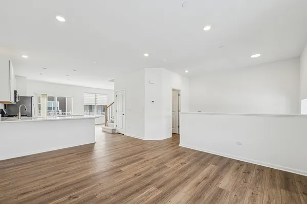 a view of kitchen and wooden floor
