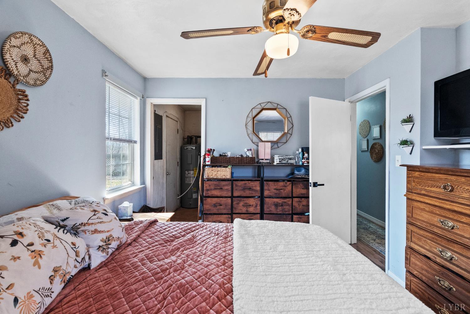 119 Dogwood Street Amherst, VA 24521 - Photo 23 of 37 a bedroom with a bed and a chandelier