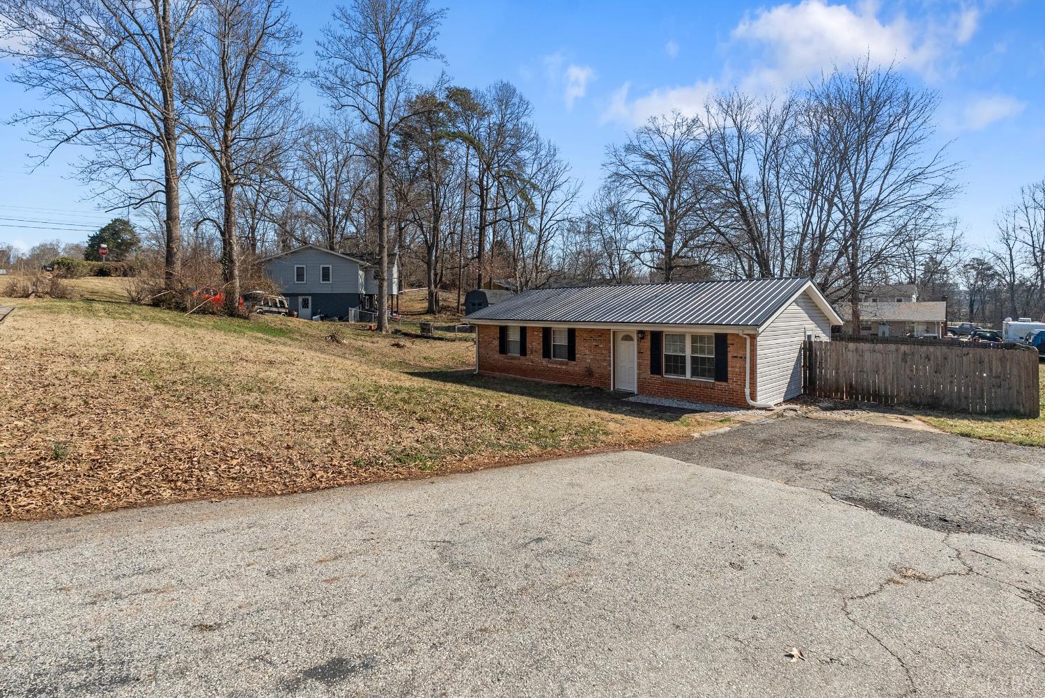119 Dogwood Street Amherst, VA 24521 - Photo 26 of 37 a front view of a house with a yard covered in snow