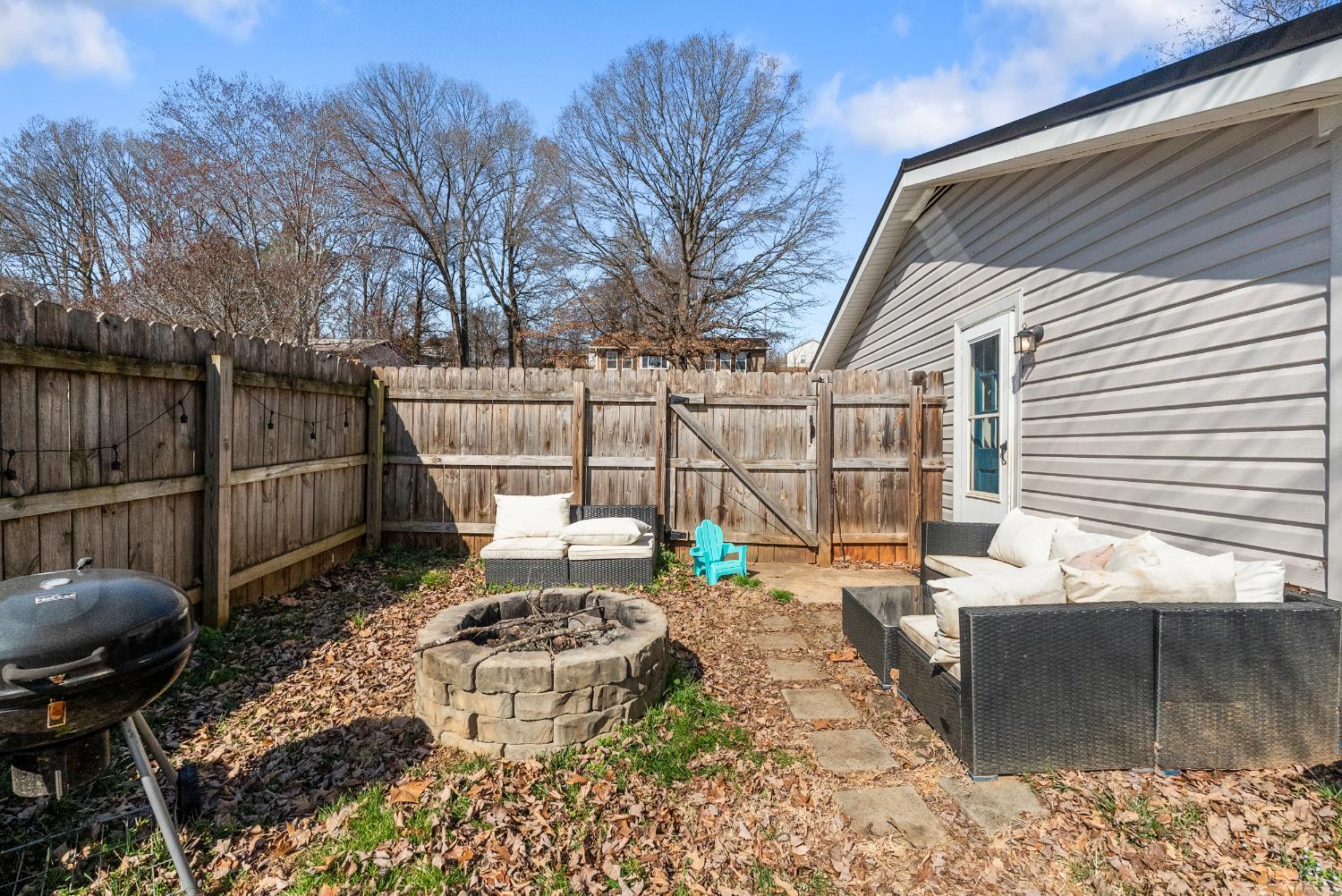 119 Dogwood Street Amherst, VA 24521 - Photo 32 of 37 a view of a backyard with table and chairs potted plants and tree