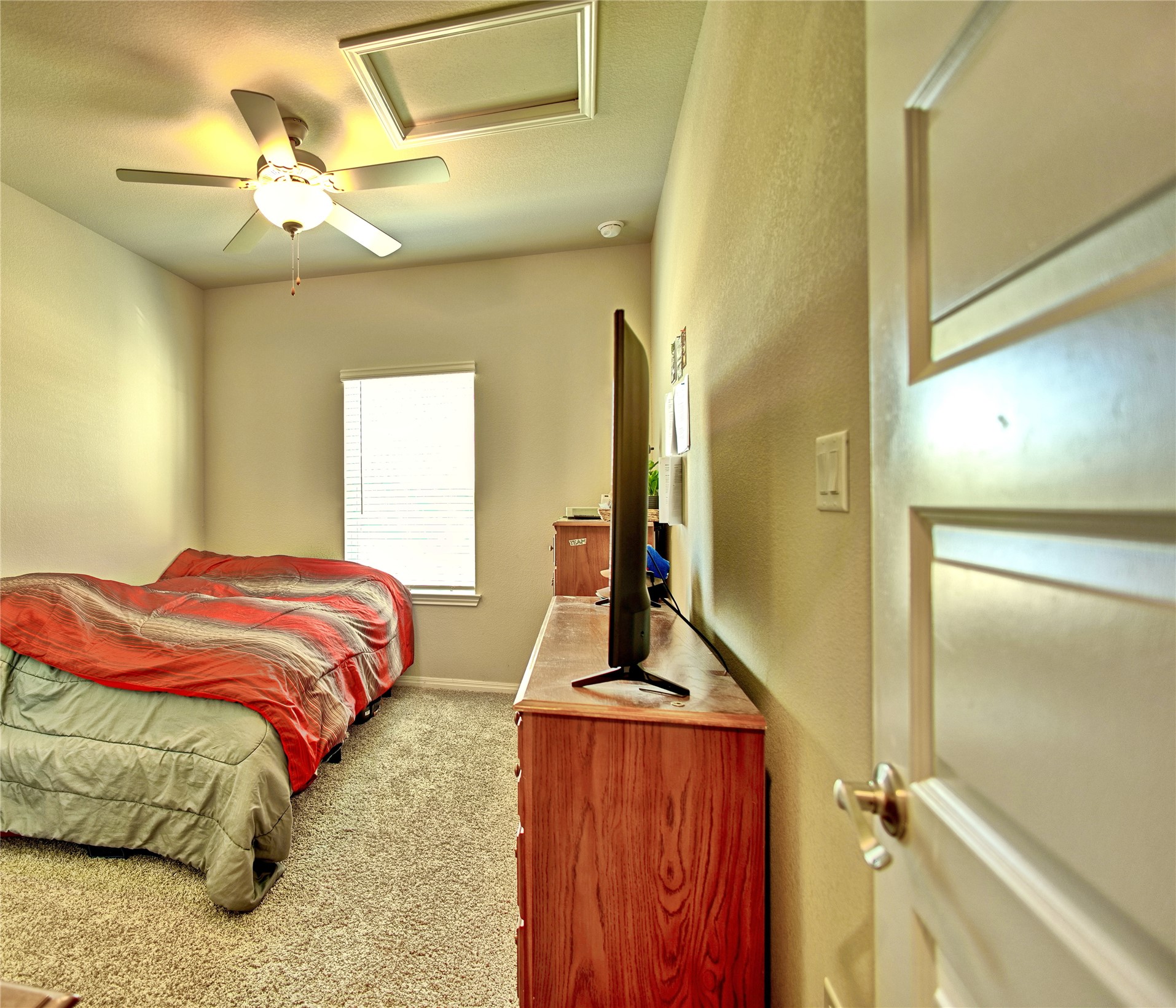 2809 Moyer Lane Round Rock, TX 78665 - Photo 10 of 22 Bedroom with a ceiling fan and light carpet