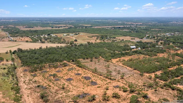 an aerial view of mountain with beach and ocean view