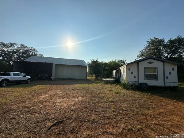 a house view with a backyard space