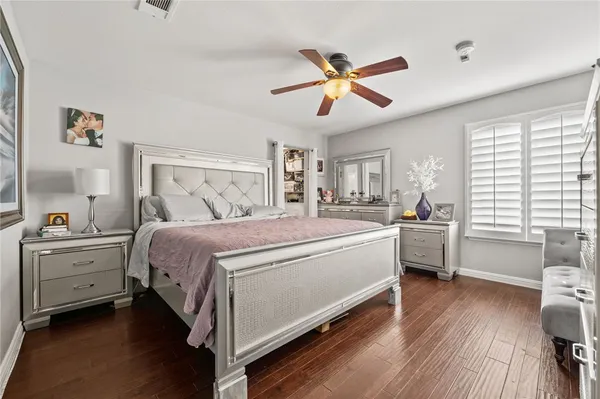 a room with a bed and a chandelier