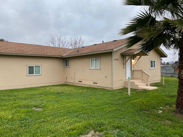 15792 Raymond Road Madera, CA 93638 - Photo 1 of 18 a house view with a garden space