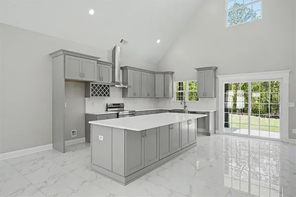 a hall with a stove and a chandelier