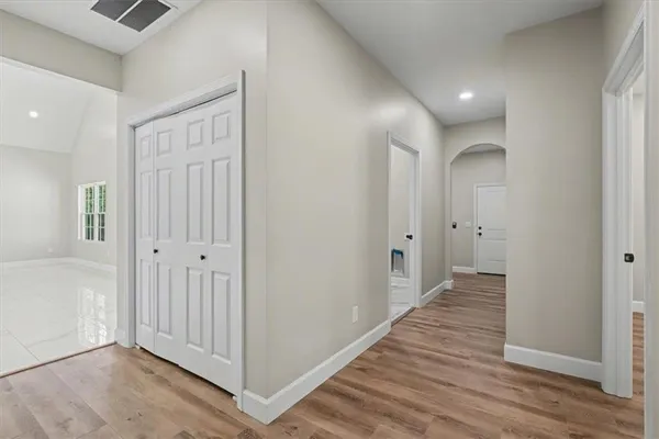 a bathroom with a shower and cabinets