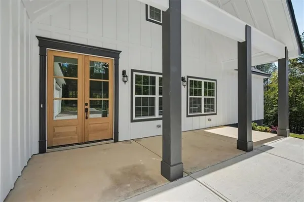 a front view of a house with a glass door and glass door