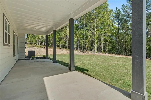 a view of a house with a yard and garage