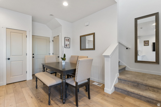 3473 Hardman Way Lehi, UT 84048 - Photo 8 of 22 Dining room with light wood finished floors, stairs, recessed lighting, and lofted ceiling