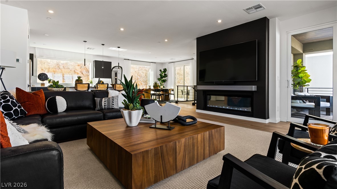 This living area seamlessly connects to the outdoors, offering a versatile space for relaxation and entertaining.