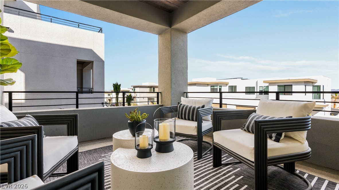 11099 Socrates Ridge Street Las Vegas, NV 89141 - Photo 2 of 29 This spacious balcony offers a refreshing outdoor retreat with abundant natural light.