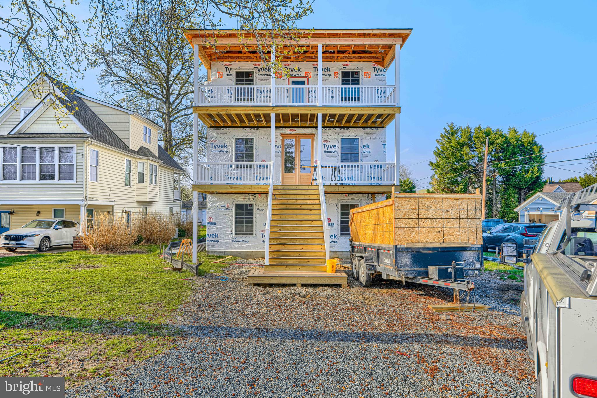 a front view of residential houses with yard