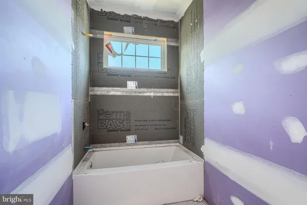 a view of a bathroom with a glass door shower