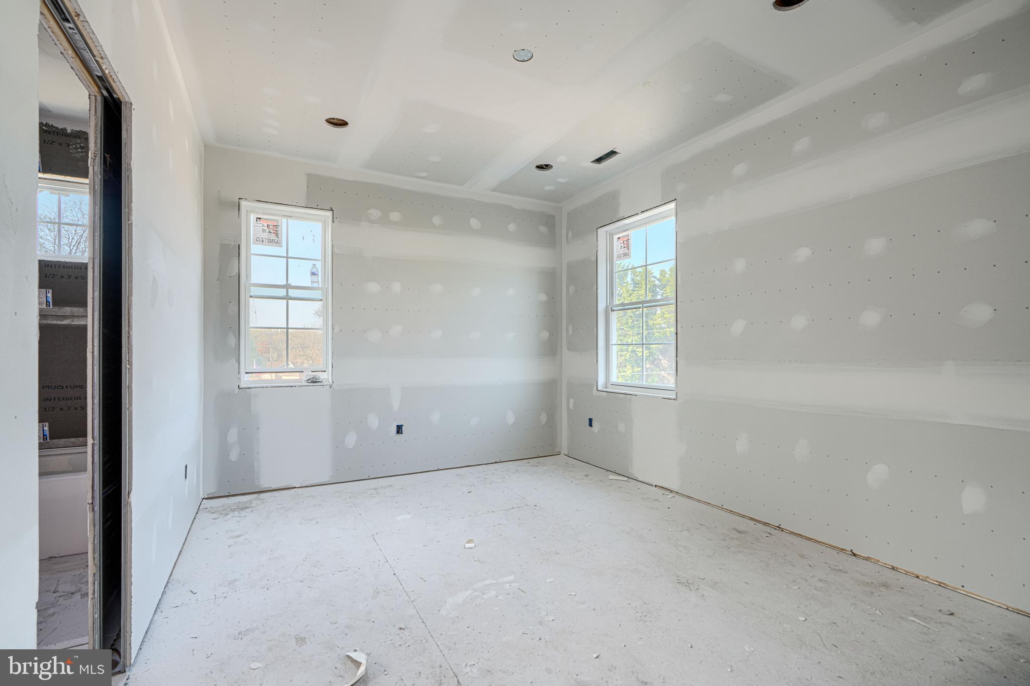 918 Sue Grove Road Essex, MD 21221 - Photo 12 of 19 an empty room with windows