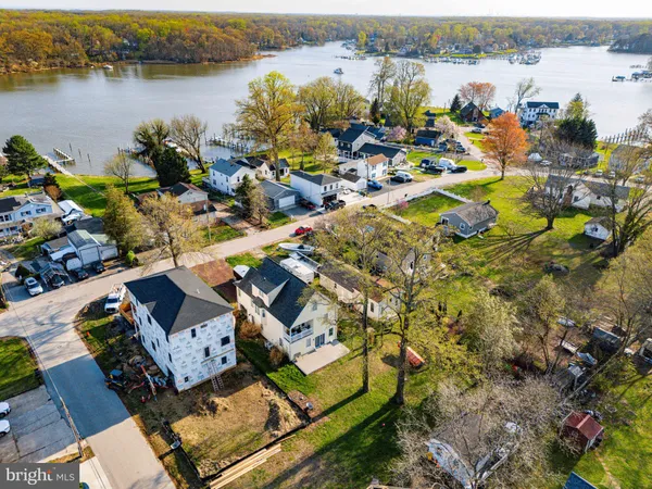 an aerial view of a house with a lake view