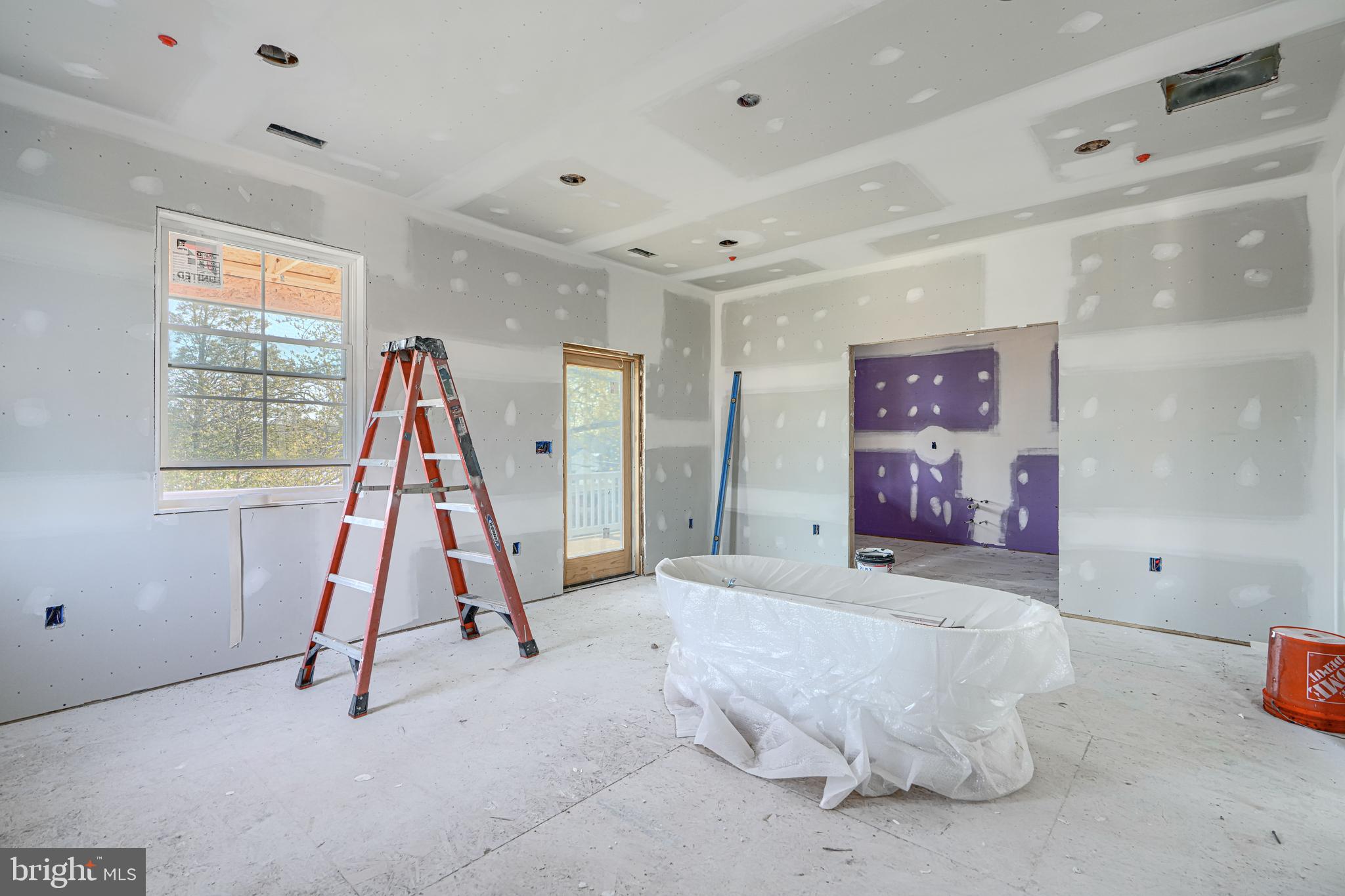 918 Sue Grove Road Essex, MD 21221 - Photo 8 of 19 a bed room with a bed and a couch