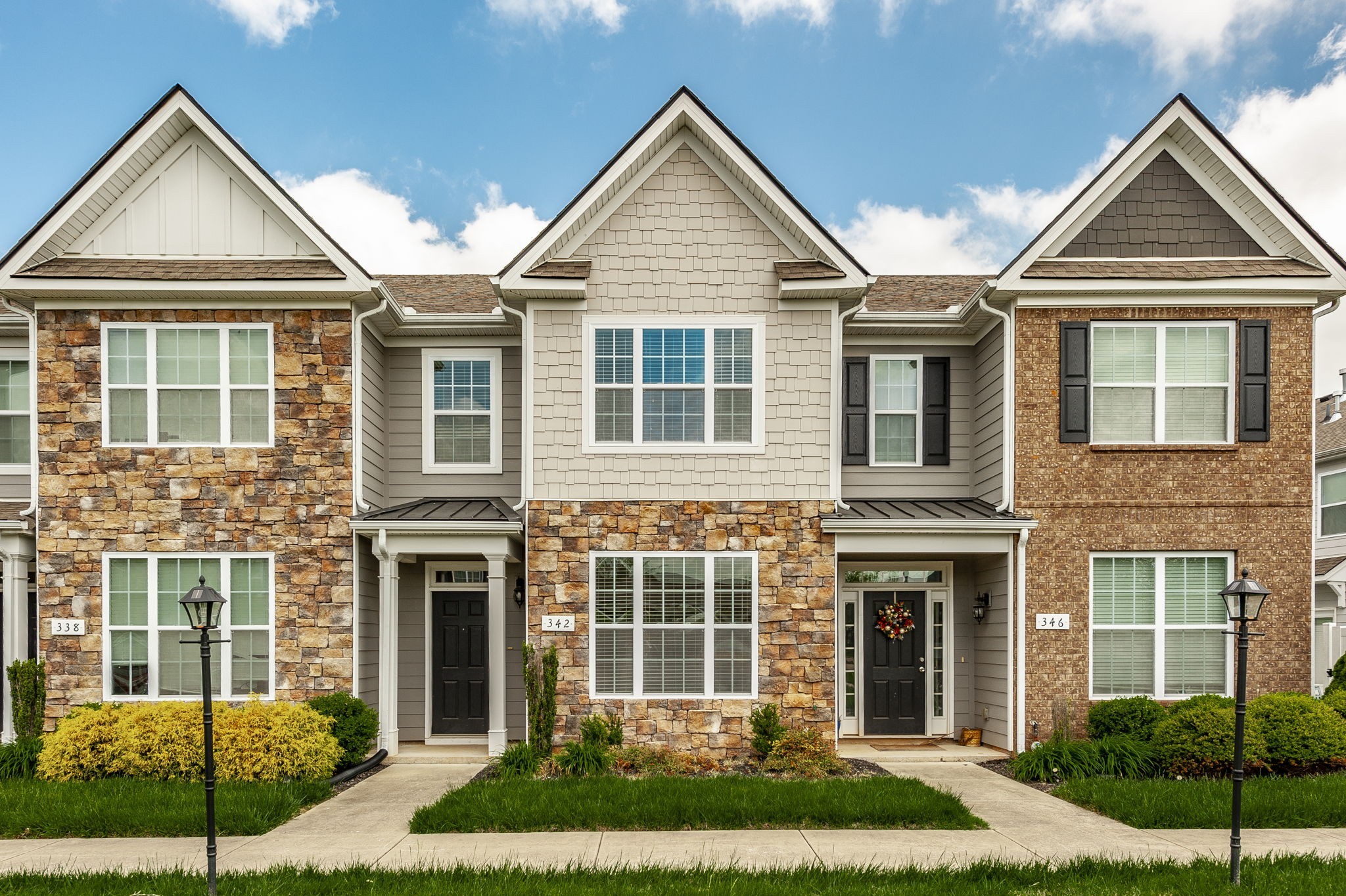 a front view of a house with garden