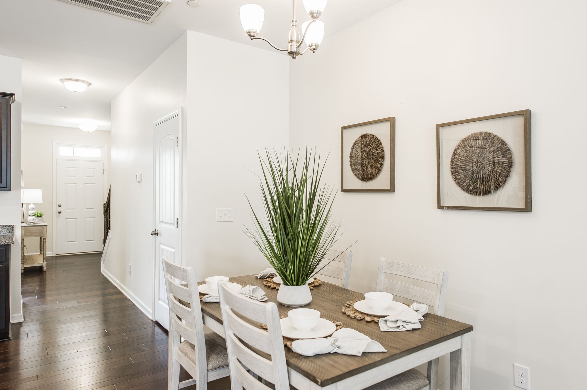 342 Manor Row Pleasant View, TN 37146 - Photo 17 of 45 a view of a dining room with furniture and wooden floor