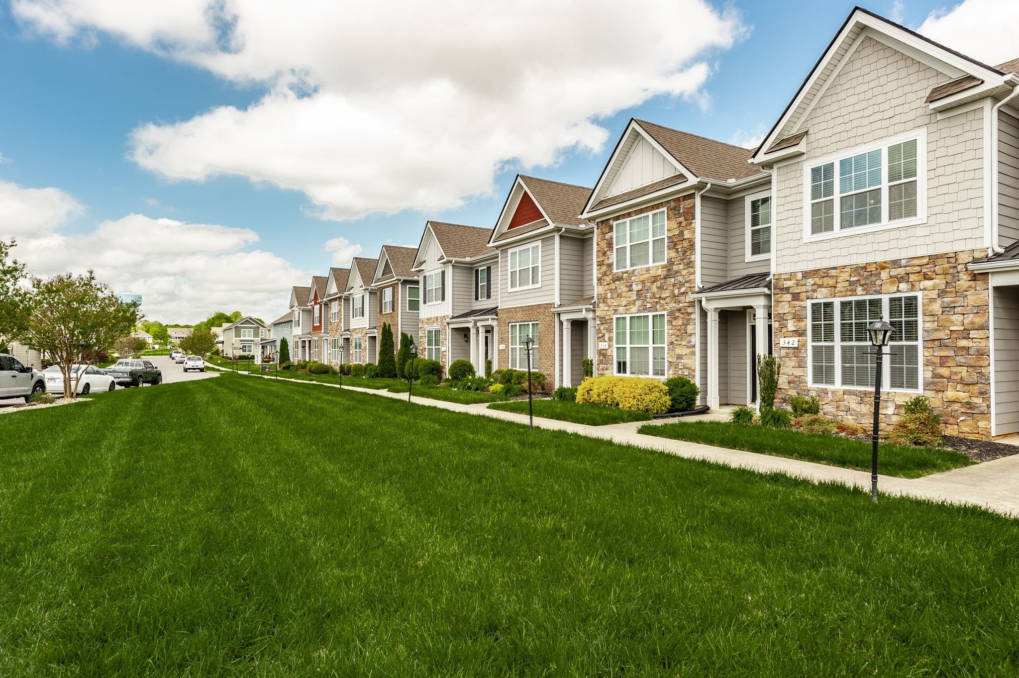 342 Manor Row Pleasant View, TN 37146 - Photo 3 of 45 a view of an apartment with a garden and plants