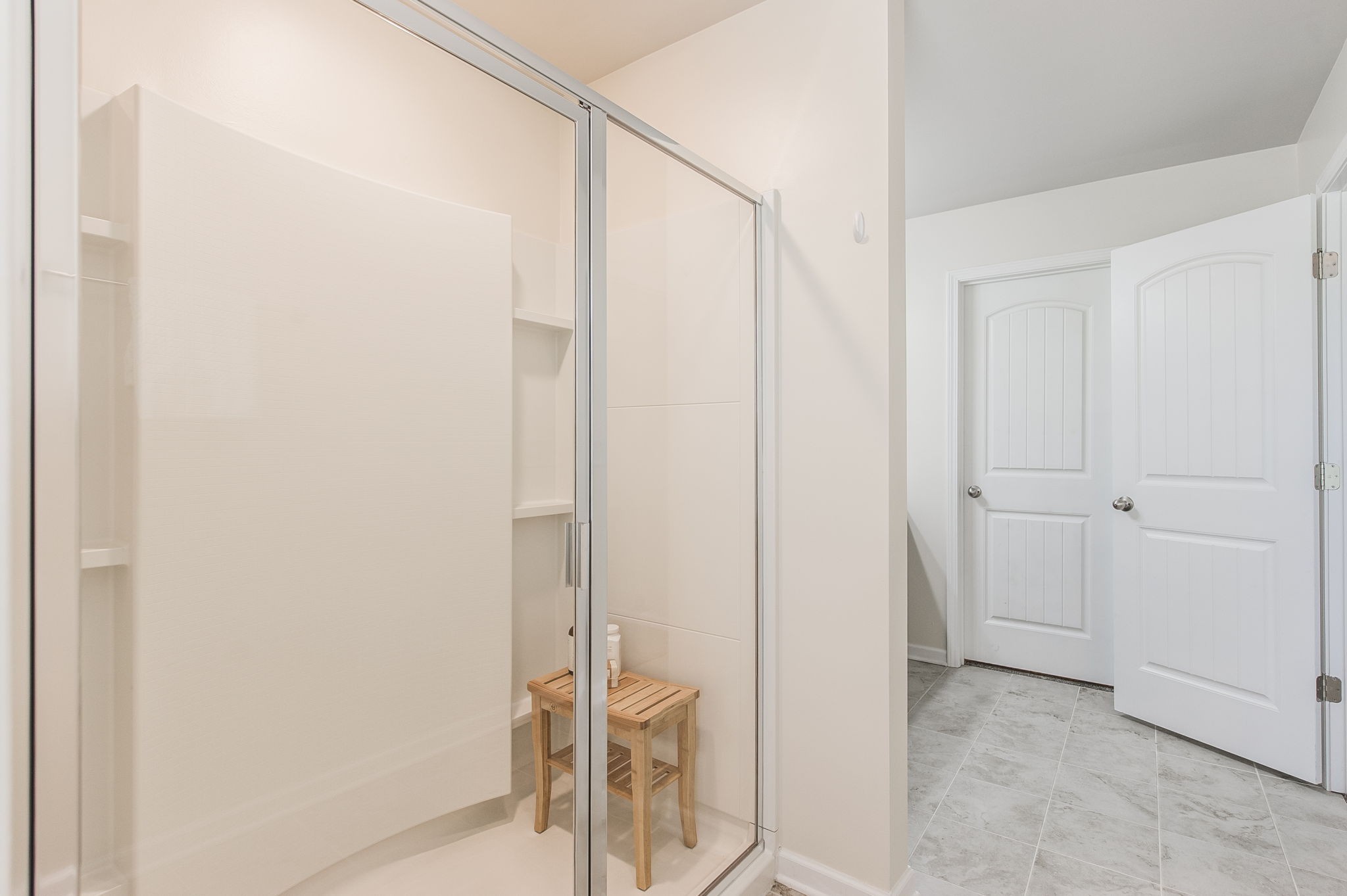 342 Manor Row Pleasant View, TN 37146 - Photo 31 of 45 a bathroom with a glass shower door