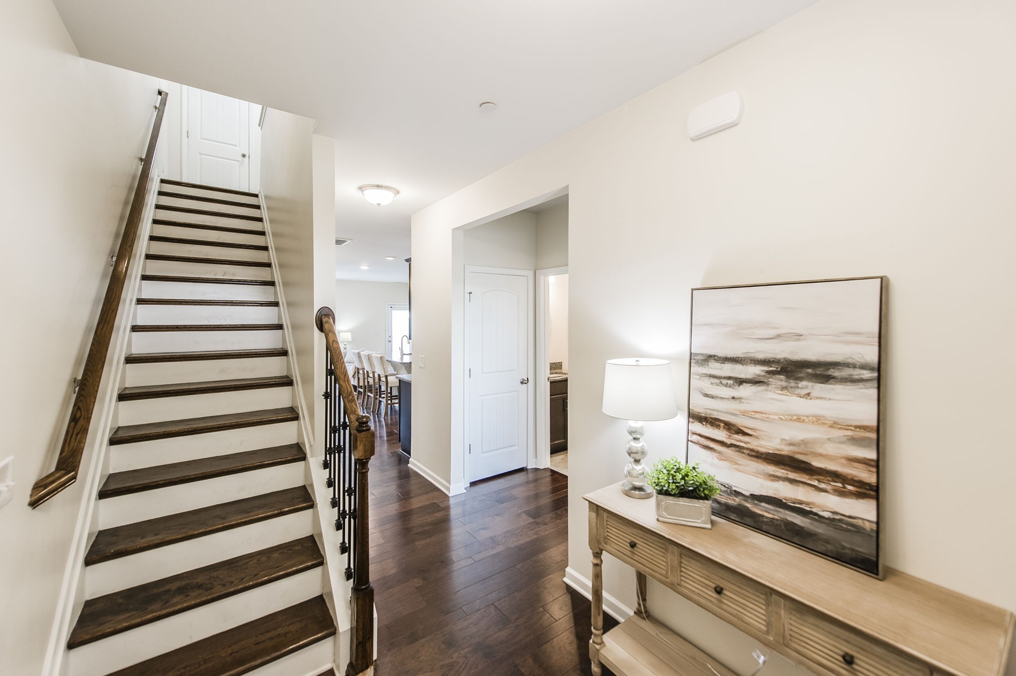 342 Manor Row Pleasant View, TN 37146 - Photo 5 of 45 a view of a hallway with wooden floor and stairs