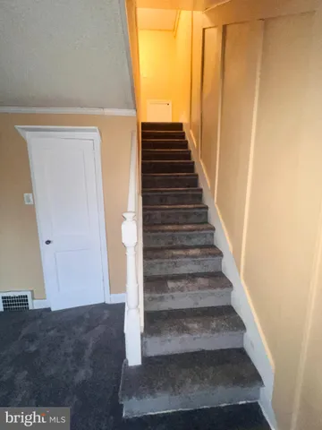 a bathroom with a bathtub sink and mirror