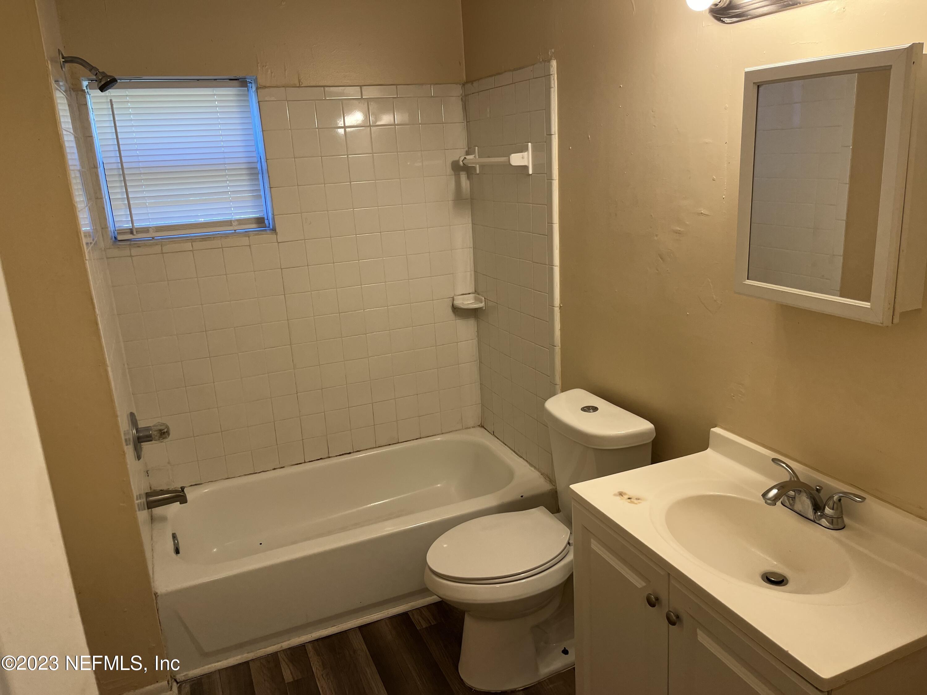 3716 Stuart Street Jacksonville, FL 32209 - Photo 12 of 13 a bathroom with a sink toilet and shower