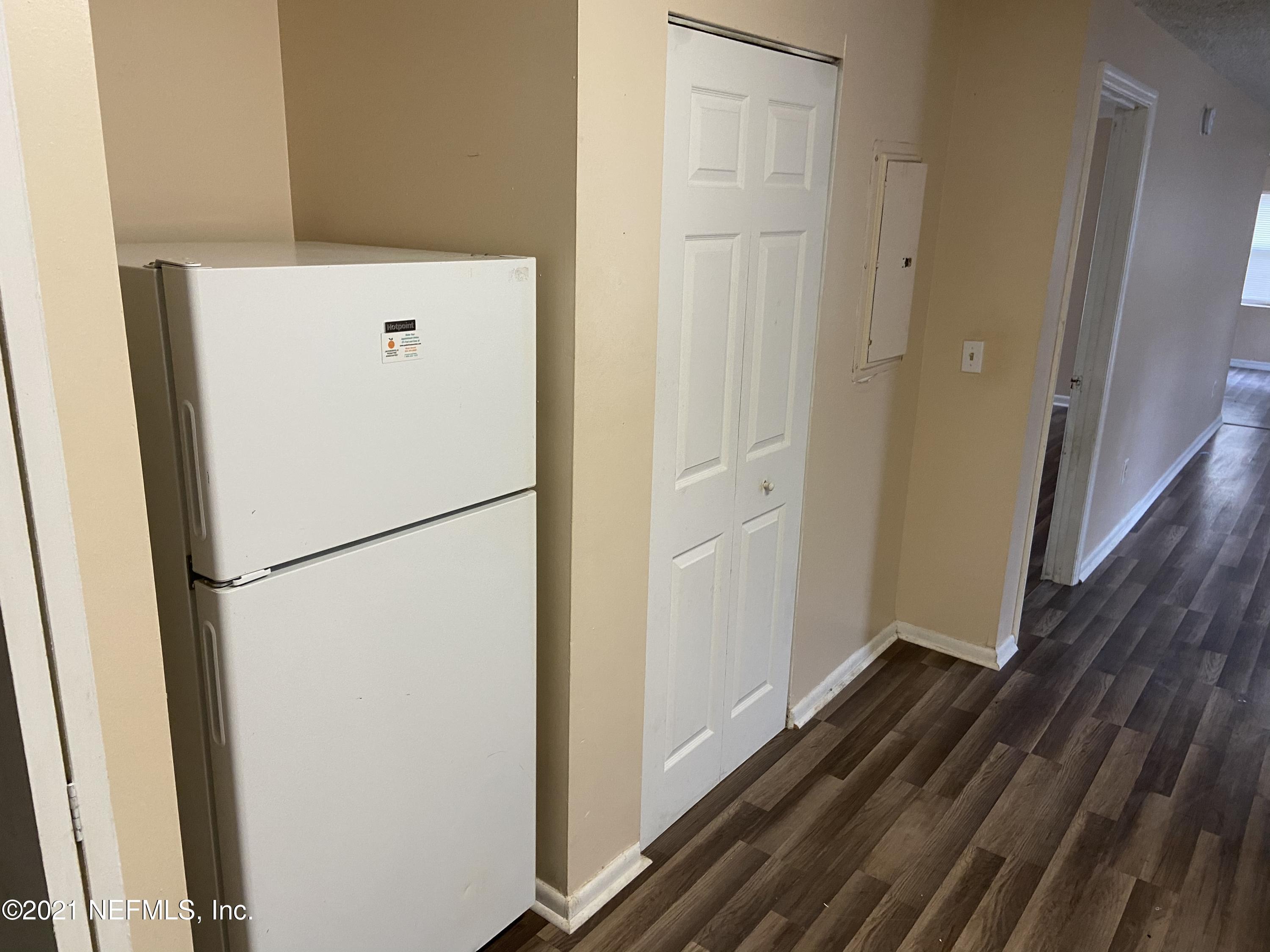 3716 Stuart Street Jacksonville, FL 32209 - Photo 5 of 13 a white refrigerator freezer and a stove sitting inside of a kitchen