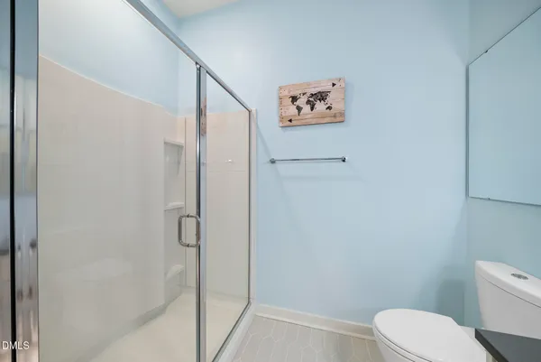a bathroom with a sink a mirror and a shower