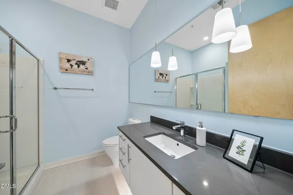 a bathroom with a shower and toilet