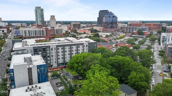 a view of a yard with a wooden fence