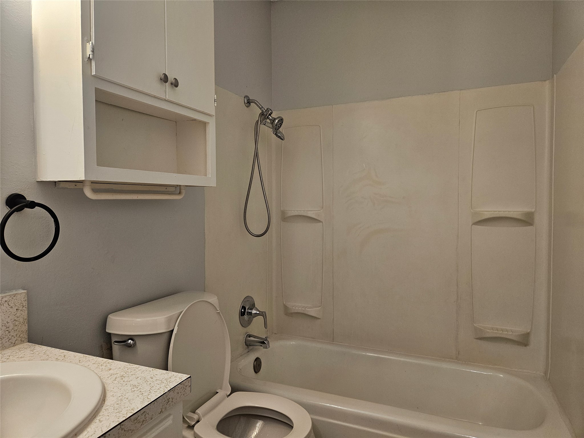 806 Ranch Road, Unit A Georgetown, TX 78628 - Photo 19 of 24 Functional full bathroom featuring a tub and shower combination with ample overhead storage.