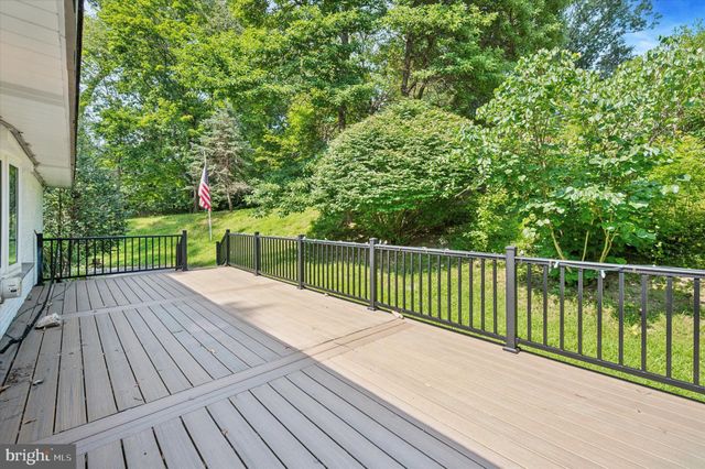 a view of balcony with wooden floor