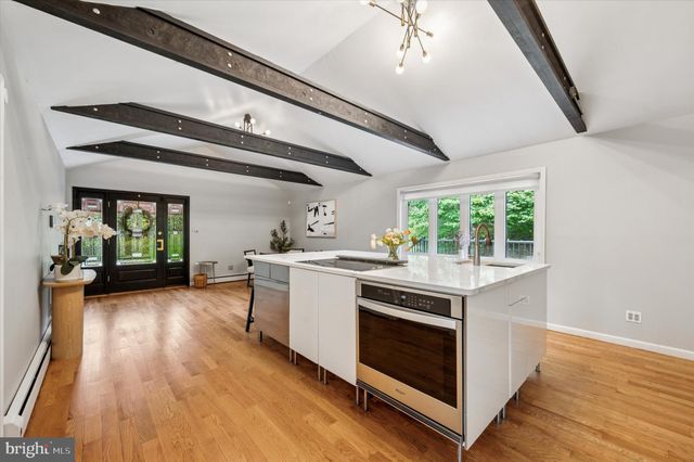a view of a kitchen with furniture and a fireplace