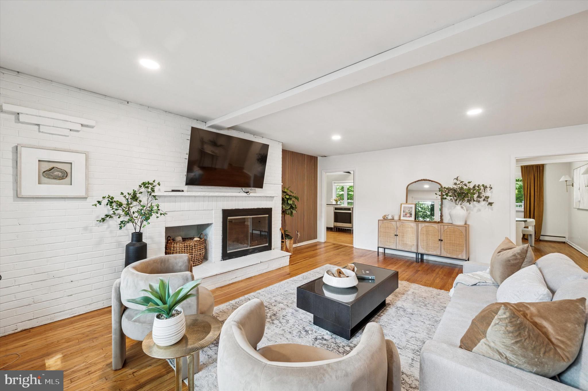 300 West Rose Tree Road Media, PA 19063 - Photo 5 of 16 a living room with furniture fireplace and a flat screen tv