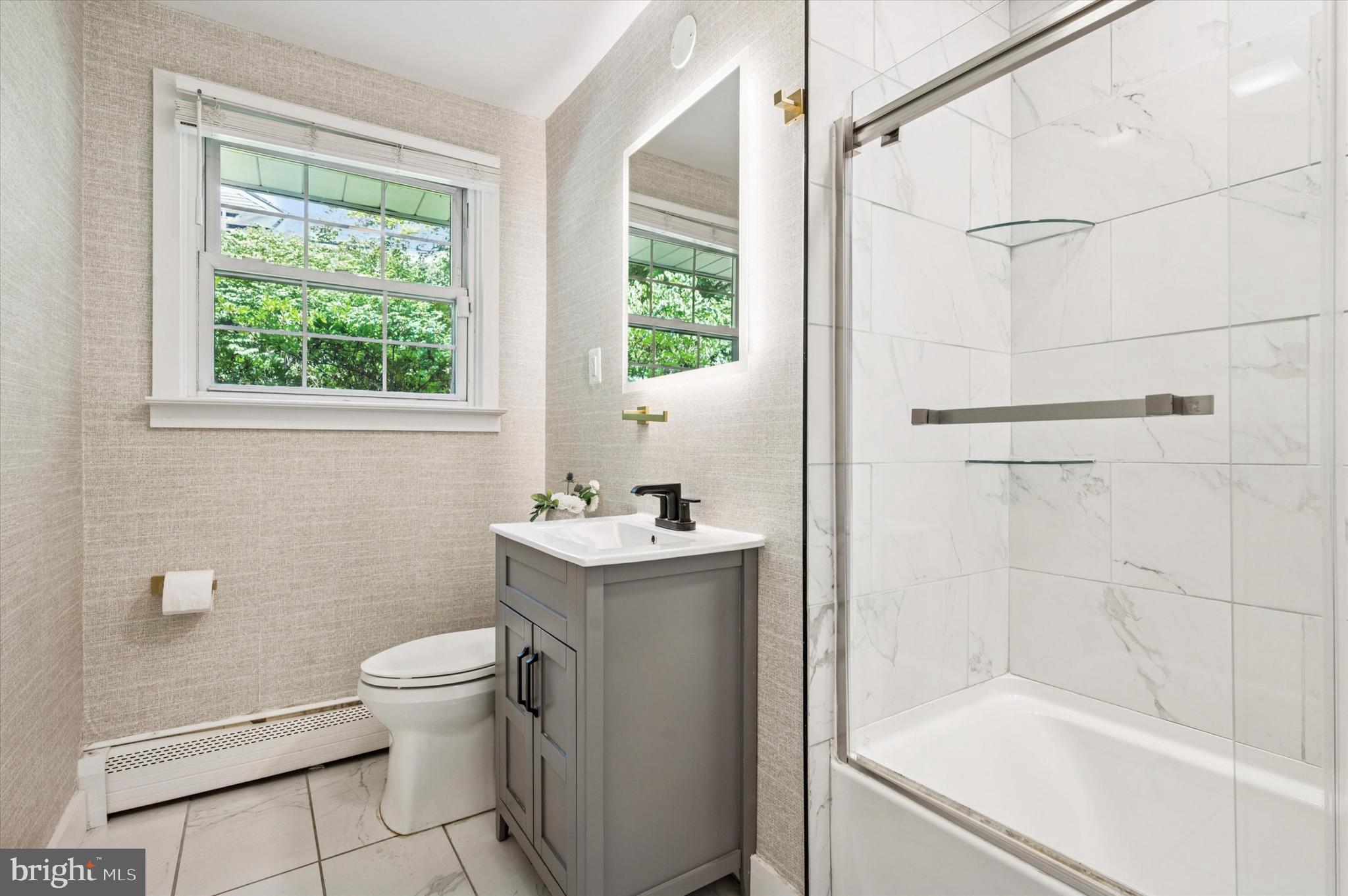 300 West Rose Tree Road Media, PA 19063 - Photo 7 of 16 a bathroom with a granite countertop sink toilet and shower